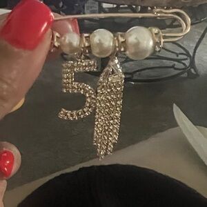 Elegant Gold and Pearl Brooch with Number 5